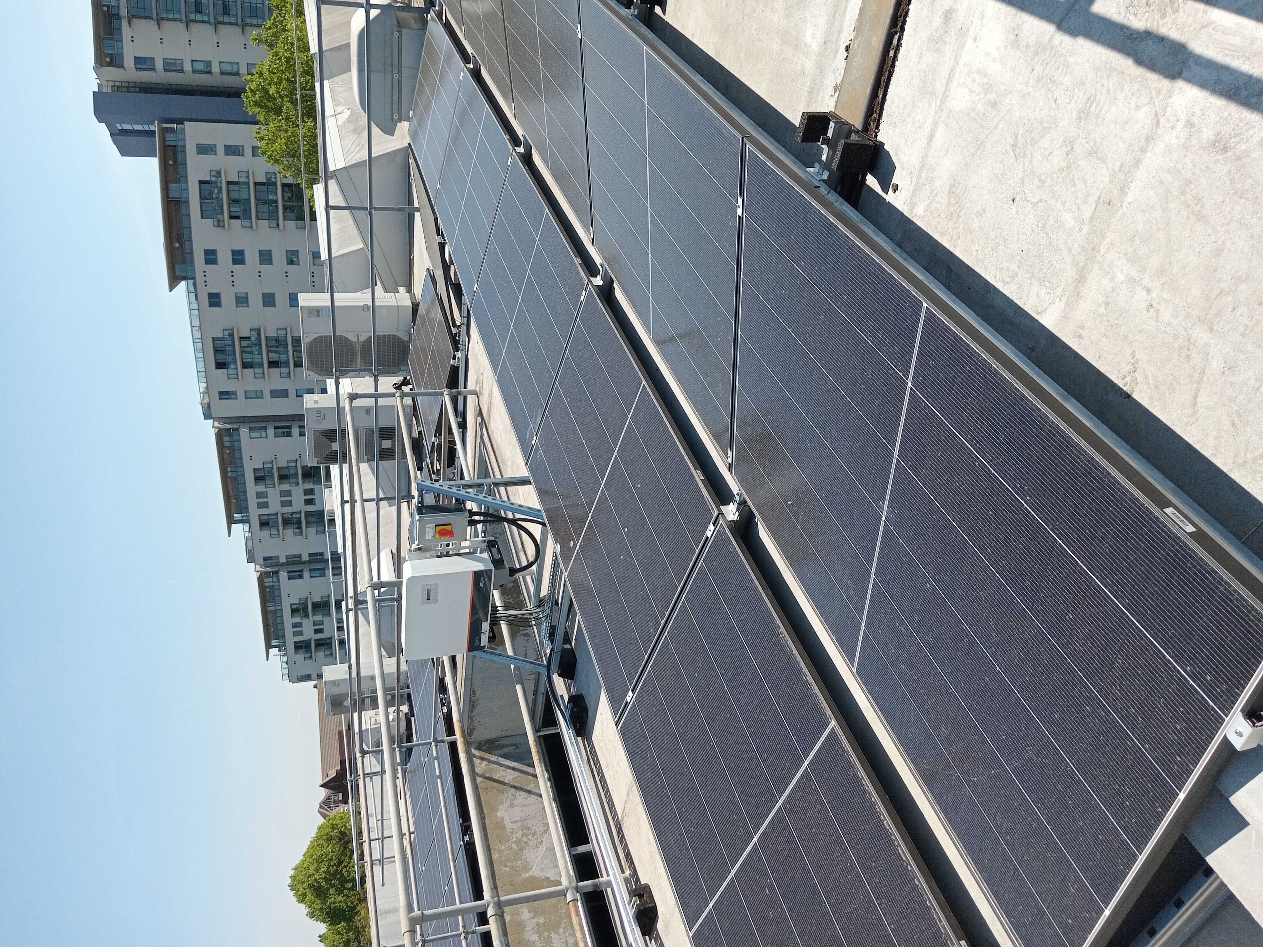 Image shows solar panels on a roof top
