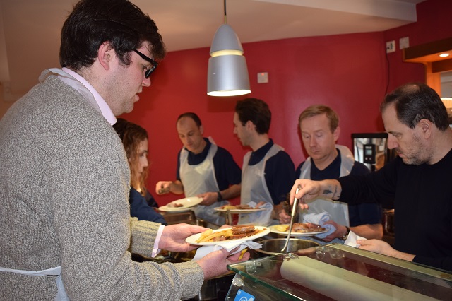 Councillor Champman serves Christmas dinner