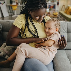 Fostering - Lady with child on her lap