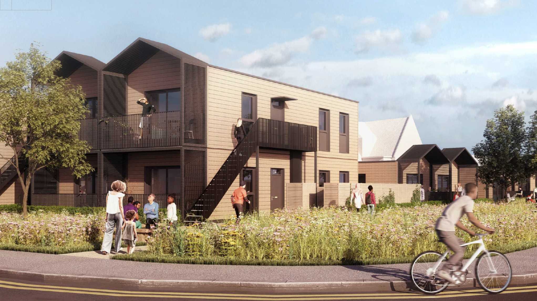 Image shows two storey modular homes with grassed area and trees