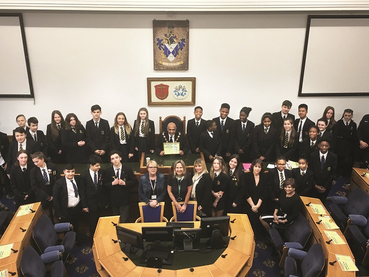 Mayor of Havering presents certificates to pupils who took part in a community volunteer day