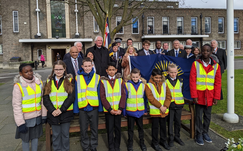 Children from Parklands School join Mayor of Havering, Leader of Havering Council and other dignitaries to raise the Commonwealth Flag.